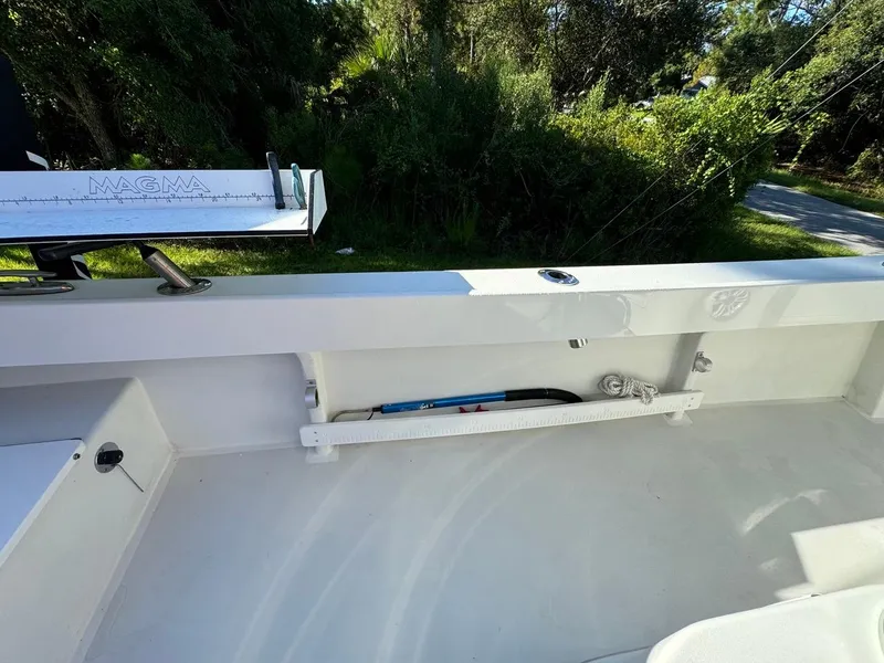 Slide: The Image of 2022 Parker 2300 Special Edition boat interior with fishing rod holder and measuring tool. - 19