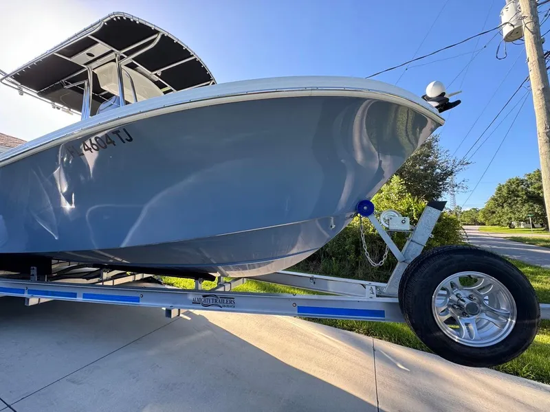 Slide: The Image of 2022 Parker 2300 Special Edition boat on trailer, sunny day, blue sky background. - 4