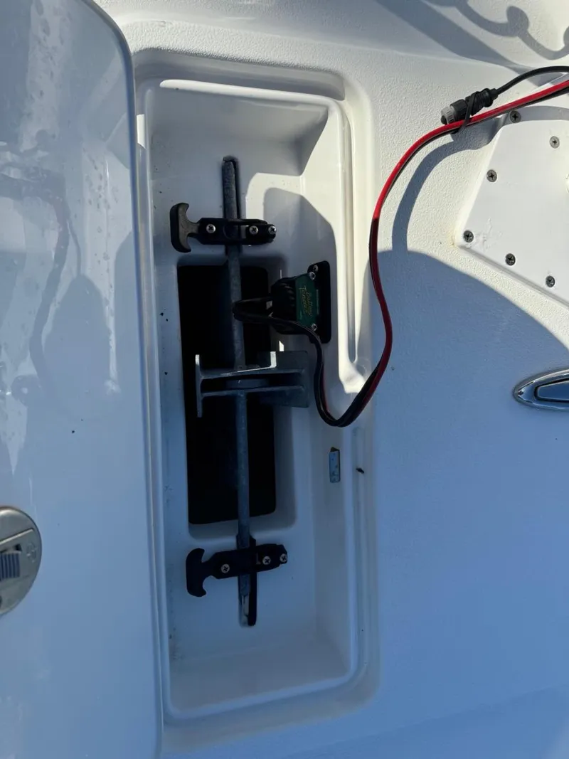 Slide: The Image of 2022 Parker 2300 Special Edition boat compartment with wiring and metal components. - 6