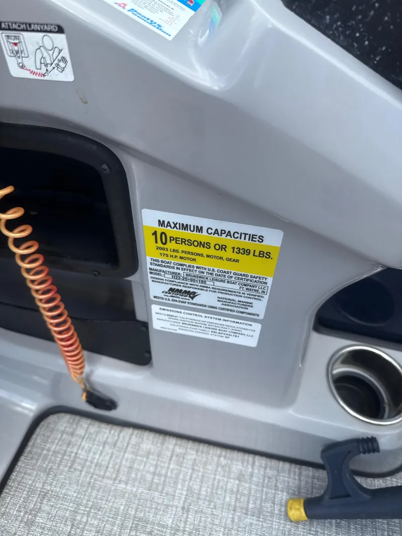 Slide: The Image of 2024 Harris Cruiser 230 capacity label, maximum 10 persons or 1339 lbs. - 9