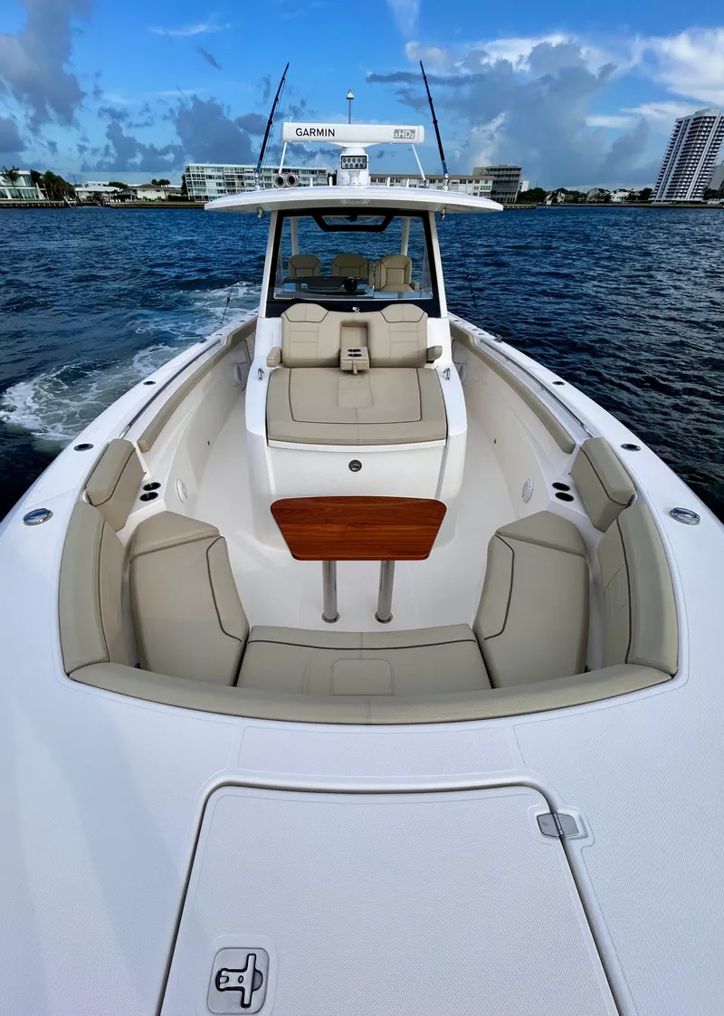 Slide: The Image of 2018 Pursuit S 368 Sport boat with spacious seating and sleek design on the water. - 11