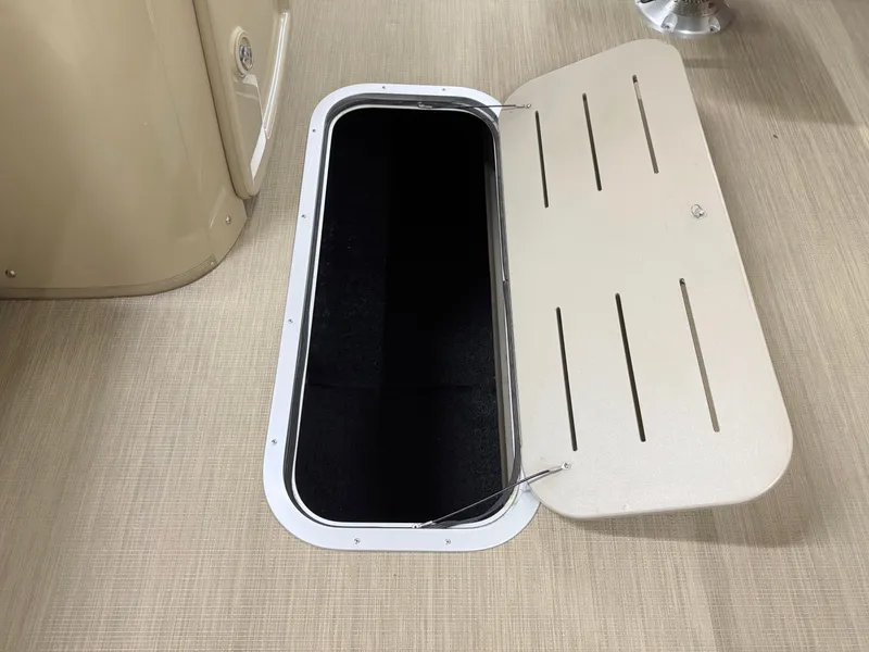 Slide: The Image of Open storage compartment on 2017 Bennington 21 SSRX boat deck. - 13