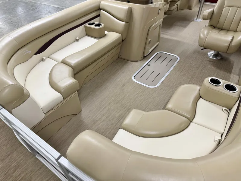Slide: The Image of Interior of a 2017 Bennington 21 SSRX boat with beige seating and cup holders. - 5