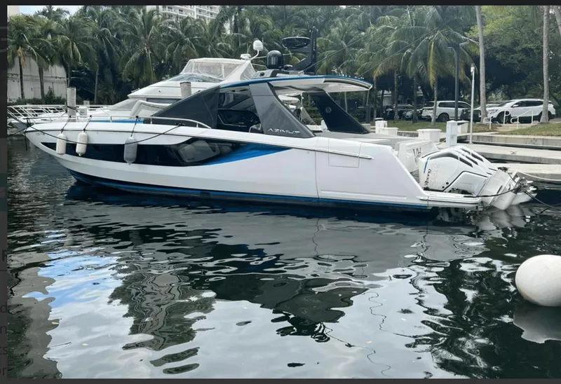 The Image of 2022 Azimut Verve 42 yacht cruising on open blue sea near a distant coastline. - 0