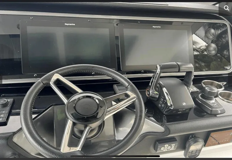 Slide: The Image of 2022 Azimut Verve 42 yacht kitchen with stainless steel appliances and sleek white cabinetry. - 14