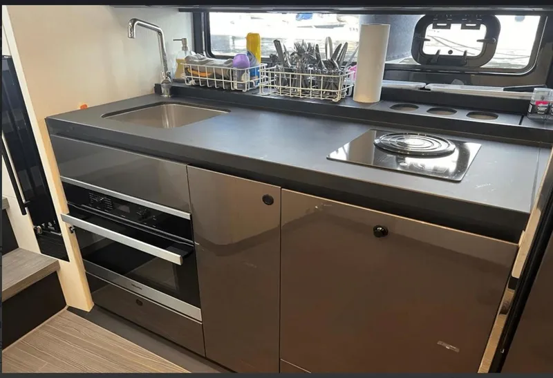 Slide: The Image of Luxurious interior of 2022 Azimut Verve 42 yacht with elegant seating and table setup. - 19