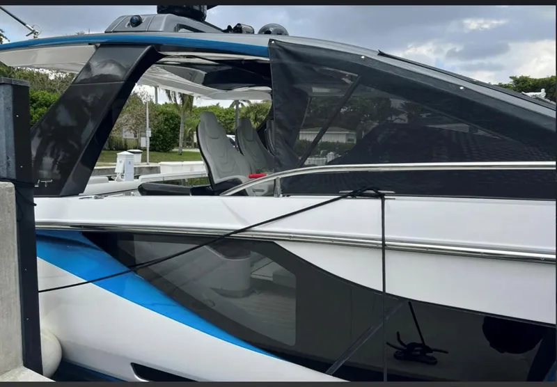 Slide: The Image of Azimut Verve 42 yacht, 2022 model, docked with triple outboard engines. - 2