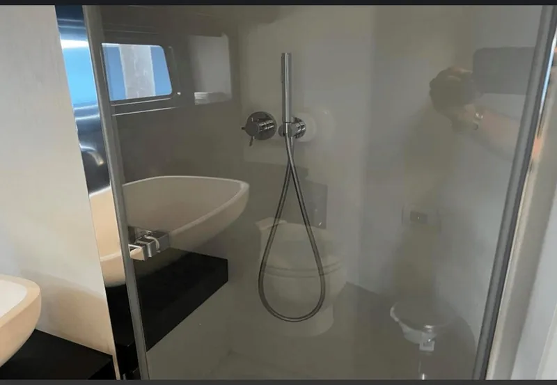 Slide: The Image of Cozy cabin interior of 2022 Azimut Verve 42 yacht with plush pillows and modern design. - 23