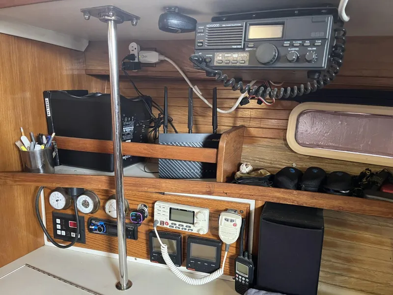 Slide: The Image of Navigation equipment and communication devices inside a 1992 Catalina 42 MK 1 sailboat cabin. - 12