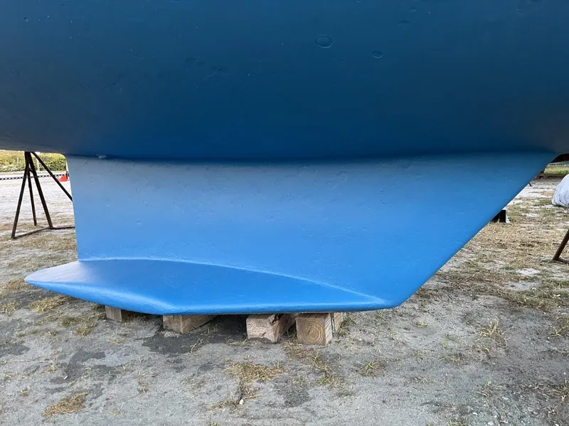 Slide: The Image of Blue keel of a 1992 Catalina 42 MK 1 sailboat on dry land. - 16