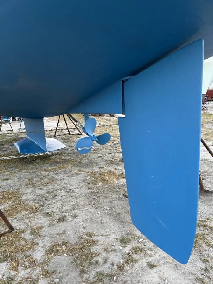 Slide: The Image of Bottom view of a 1992 Catalina 42 MK 1 sailboat, showing the propeller and rudder. - 22