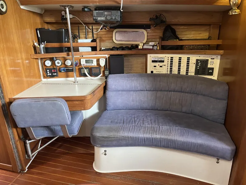Slide: The Image of Interior of 1992 Catalina 42 MK 1 sailboat with navigation station and seating area. - 24