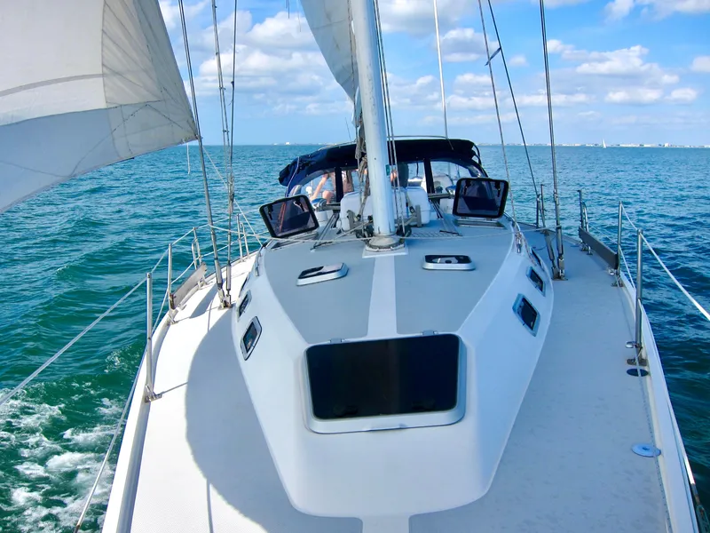 Slide: The Image of Sailing on a 1992 Catalina 42 MK 1 yacht in open waters under clear skies. - 25