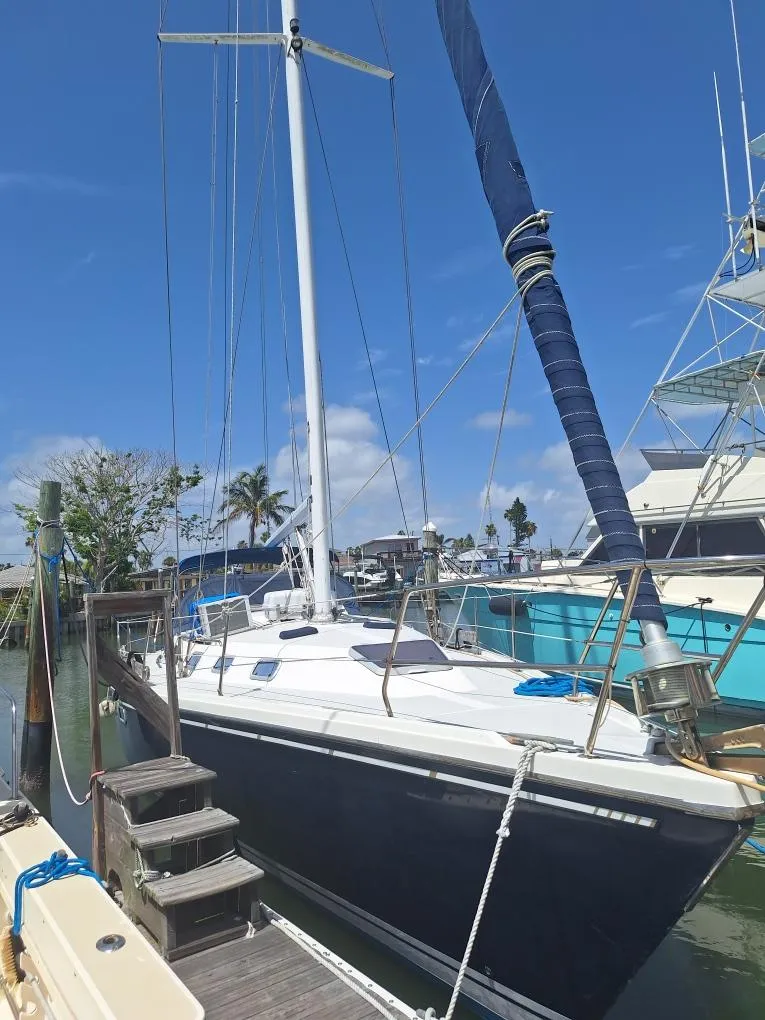 Slide: The Image of Sailboat Catalina 42 MK 1, 1992 model, docked under clear blue sky. - 29