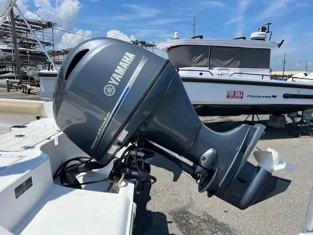 Slide: The Image of Yamaha outboard motor on 2016 Sea Fox 186 Commander boat, parked with other boats. - 11