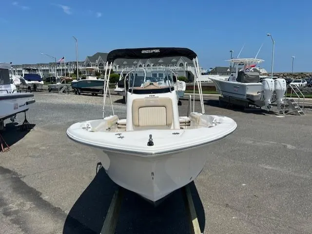 Slide: The Image of 2016 Sea Fox 186 Commander boat on display at a marina under clear blue skies. - 15