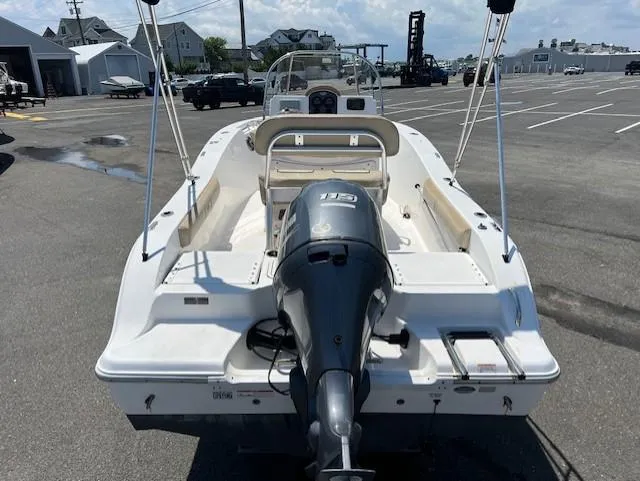 Slide: The Image of 2016 Sea Fox 186 Commander boat with outboard motor in a parking lot. - 16