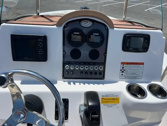 Slide: The Image of Control panel of a 2016 Sea Fox 186 Commander boat with steering wheel and gauges. - 5