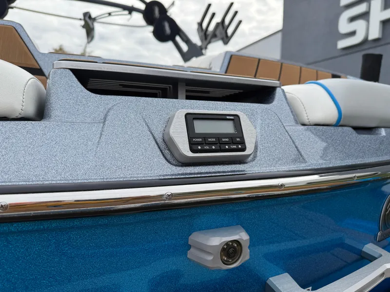 Slide: The Image of 2020 Malibu Wakesetter 23 MXZ dashboard with control panel and camera, featuring sleek design. - 10