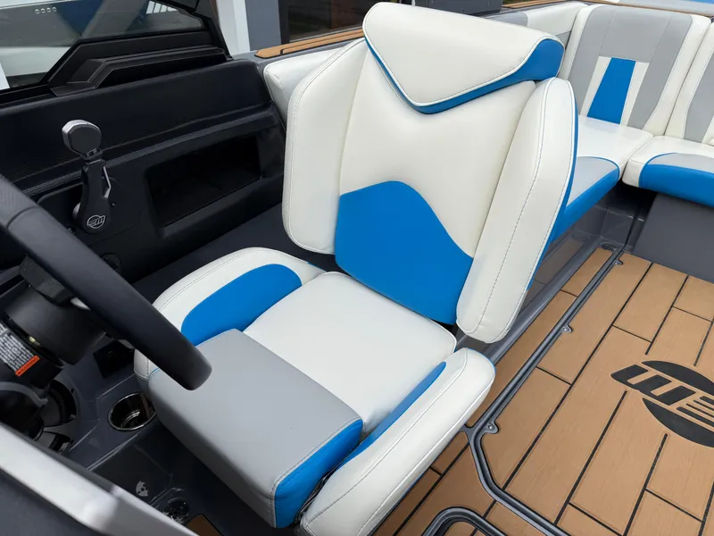 Slide: The Image of 2020 Malibu Wakesetter 23 MXZ interior with blue and white seating, modern design. - 22