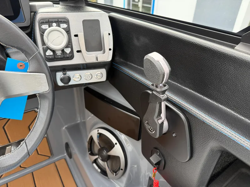 Slide: The Image of 2020 Malibu Wakesetter 23 MXZ dashboard with steering wheel and control panel. - 25