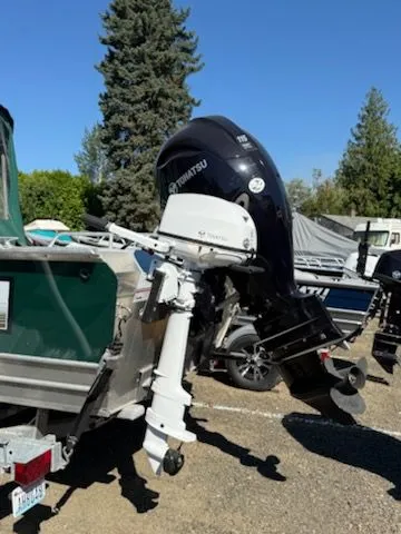 Slide: The Image of 2019 Klamath 19 GTX boat with Tohatsu outboard motor in a sunny outdoor setting. - 6