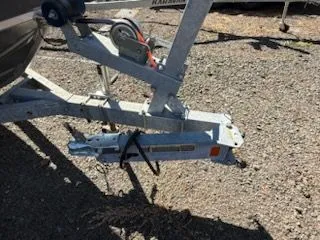 Slide: The Image of Trailer hitch of a 2019 Klamath 19 GTX boat on gravel surface. - 7