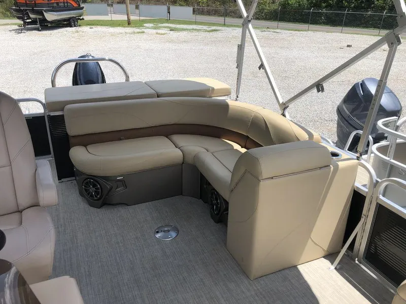 Slide: The Image of 2019 Avalon GS Cruise 23' pontoon boat with beige seating and outdoor setting. - 4