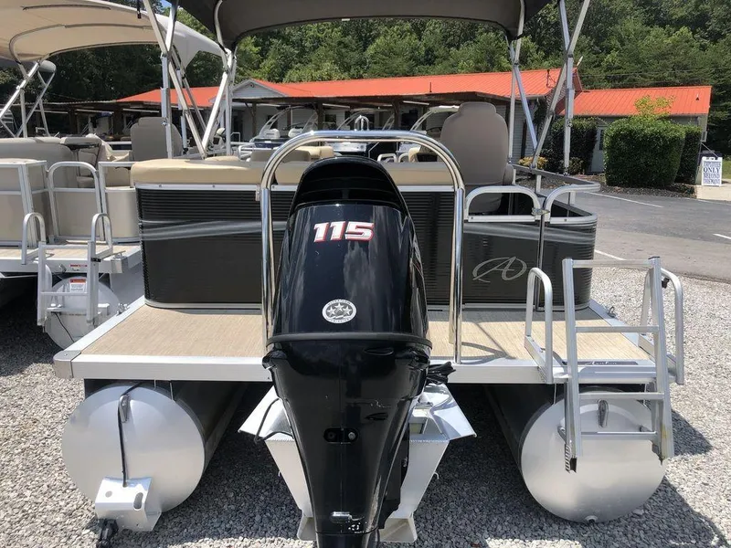 Slide: The Image of 2019 Avalon GS Cruise 23' pontoon boat with 115 HP outboard motor, parked on gravel. - 7
