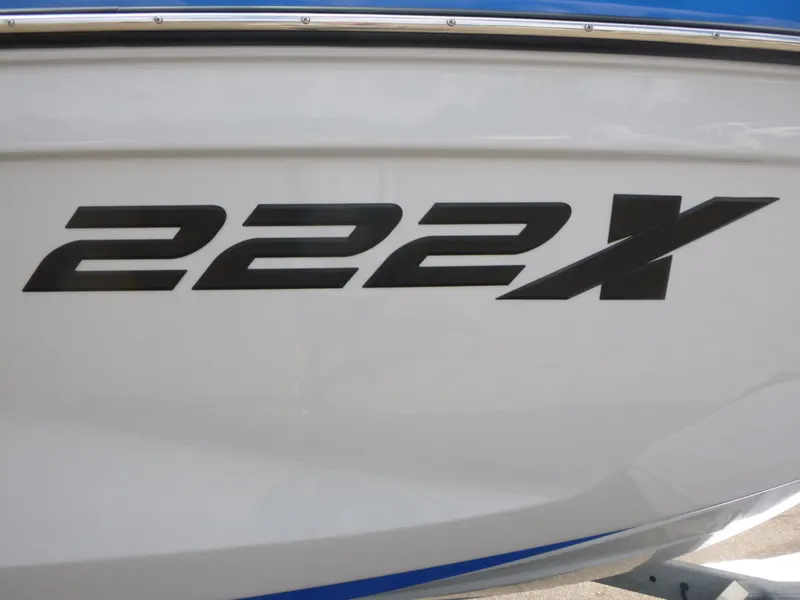 Slide: The Image of 2025 Yamaha Boats 222XD model logo on boat hull, featuring bold black lettering. - 14