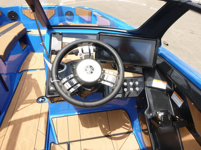 Slide: The Image of 2025 Yamaha Boats 222XD cockpit with steering wheel, touchscreen, and modern controls. - 8