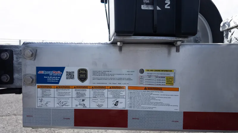 Slide: The Image of Trailer warning labels and instructions on a Tidewater 302CC, 2026 model. - 11