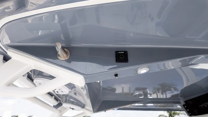 Slide: The Image of 2026 Tidewater 302CC boat interior detail with shower control and sleek design. - 19