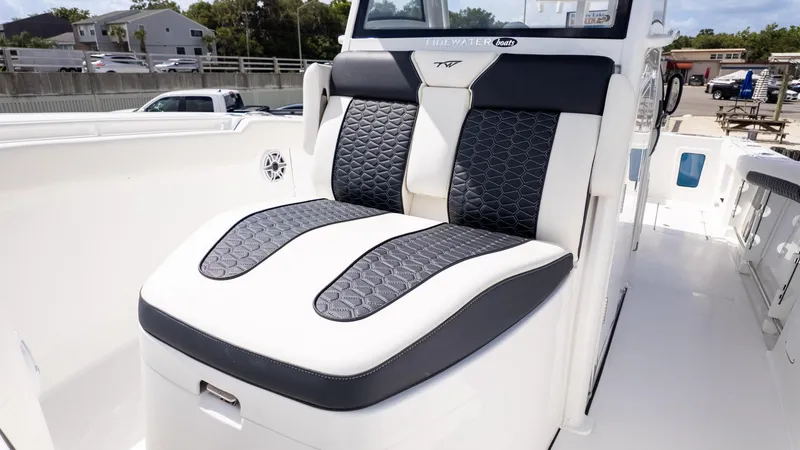 Slide: The Image of 2026 Tidewater 302CC boat with stylish black and white seating. - 6
