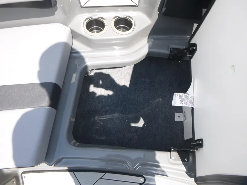 Slide: The Image of Interior of 2025 Yamaha Boats 222XD showing seating and cup holders. - 12