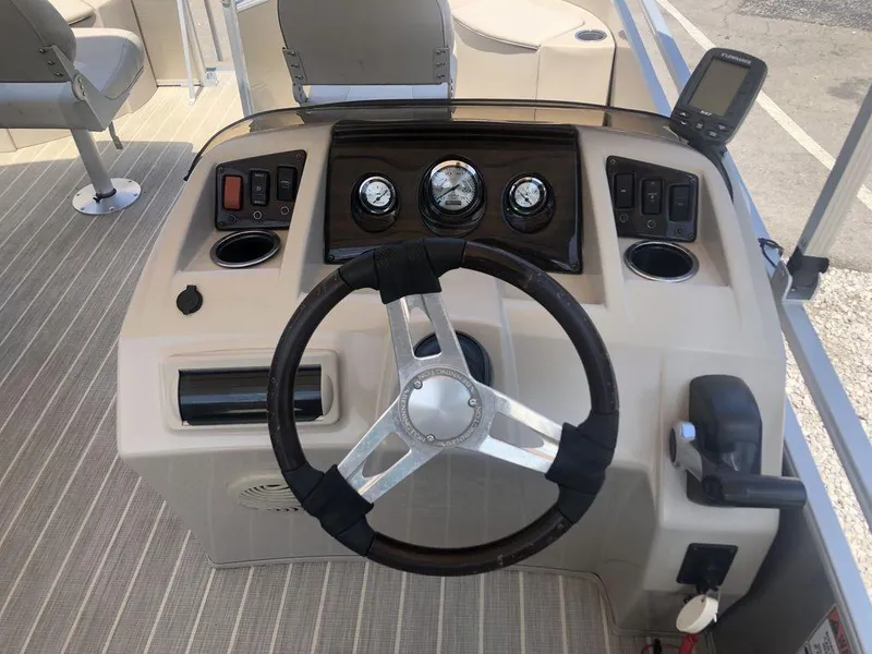 Slide: The Image of 2024 Bennington 20 SF boat dashboard with steering wheel and control panel. - 5