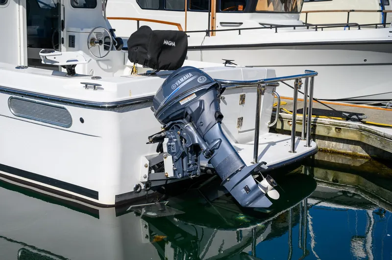 Slide: The Image of 2021 Ocean Sport 26/27 boat with Yamaha outboard motor docked at marina. - 10