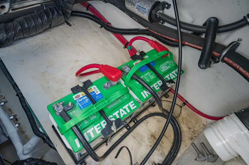 Slide: The Image of Batteries in a 2015 Regal 2700 ES Bowrider boat engine compartment. - 22
