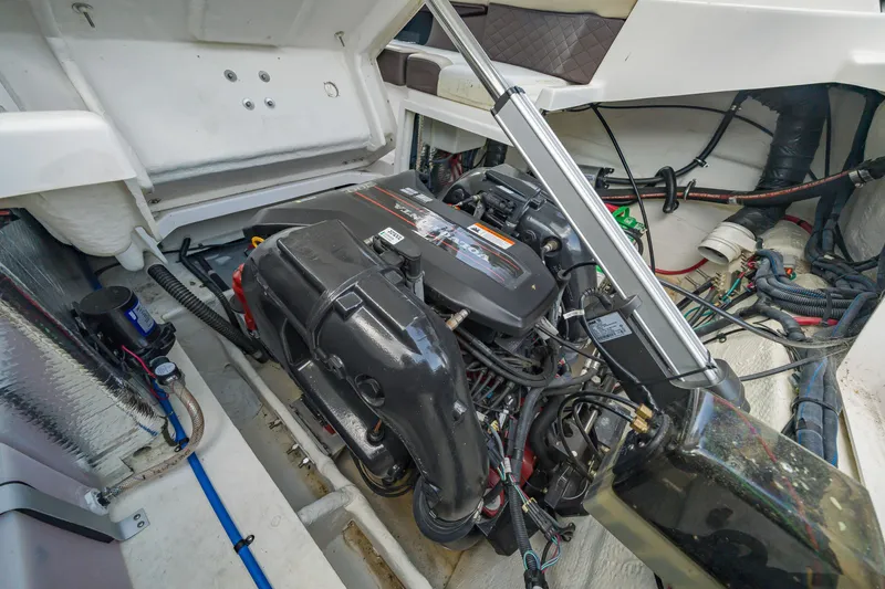 Slide: The Image of Engine compartment of a 2015 Regal 2700 ES Bowrider boat, showcasing detailed components. - 23