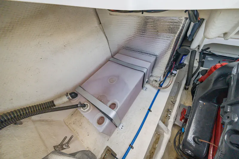 Slide: The Image of 2015 Regal 2700 ES Bowrider engine compartment with fuel tank and wiring. - 24