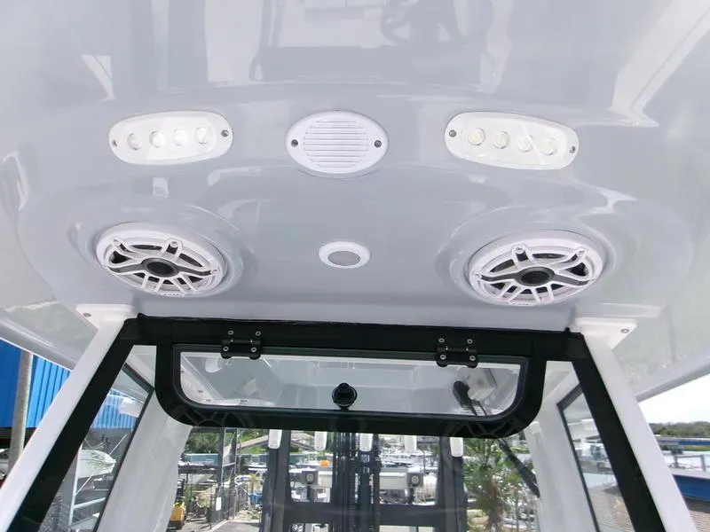 Slide: The Image of Ceiling view of 2026 Sportsman Open 232 boat with speakers and lights. - 12