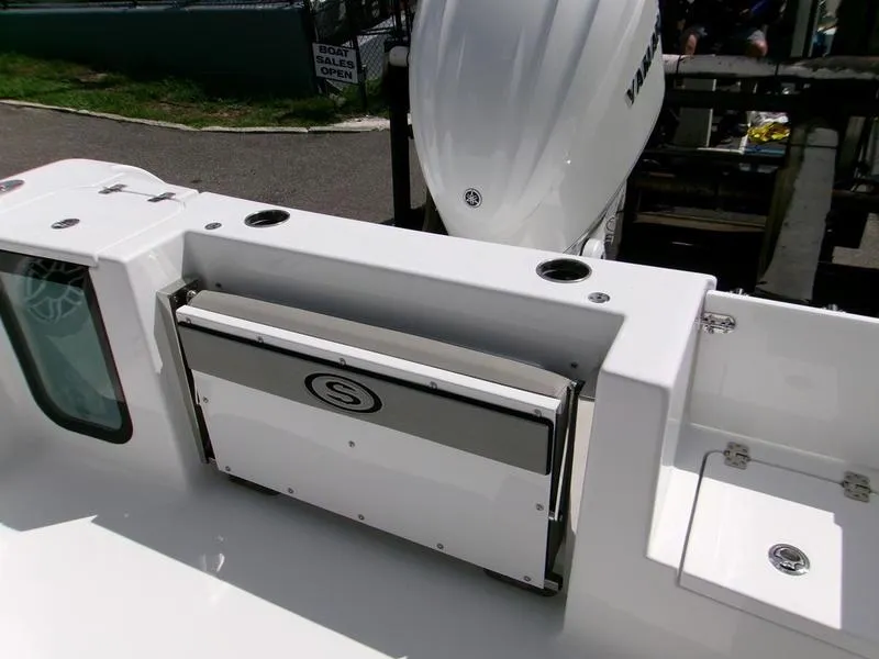 Slide: The Image of 2026 Sportsman Open 232 boat interior with seating and storage compartments. - 8