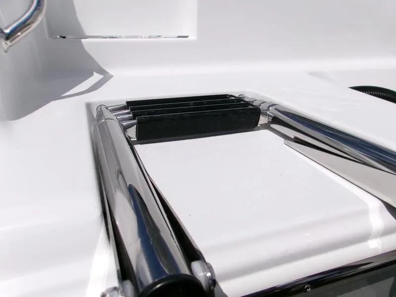 Slide: The Image of 2026 Sportsman Open 232 boat ladder detail, featuring sleek chrome finish. - 9