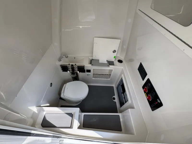 Slide: The Image of 2025 Sailfish 312 CC boat interior with modern bathroom amenities and sleek design. - 33
