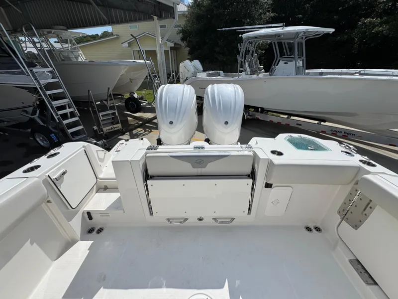 Slide: The Image of 2025 Sailfish 312 CC boat with dual engines, spacious deck, and modern amenities. - 45