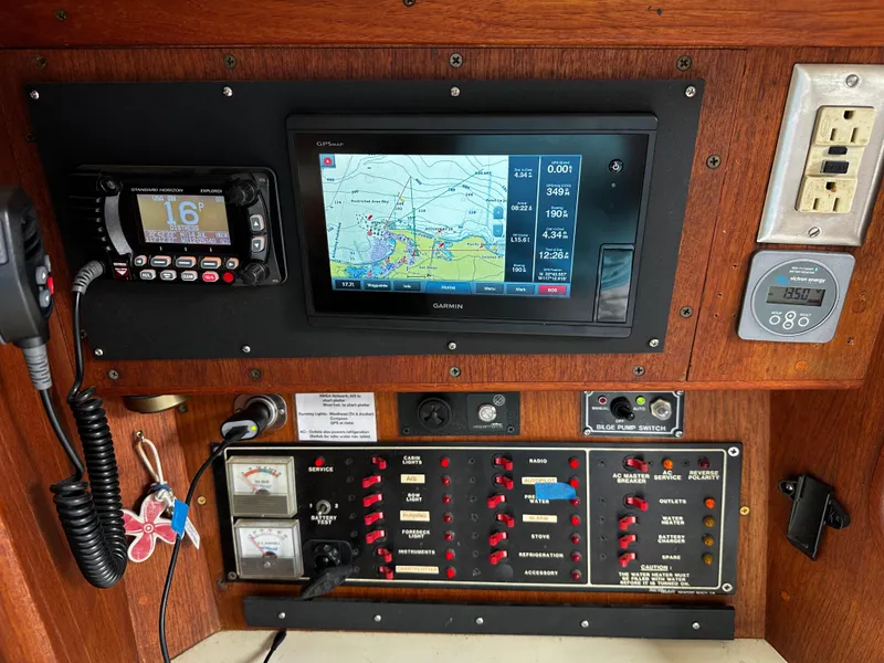 Slide: The Image of Control panel of a 1987 Ericson 34 2 sailboat with navigation and communication equipment. - 15