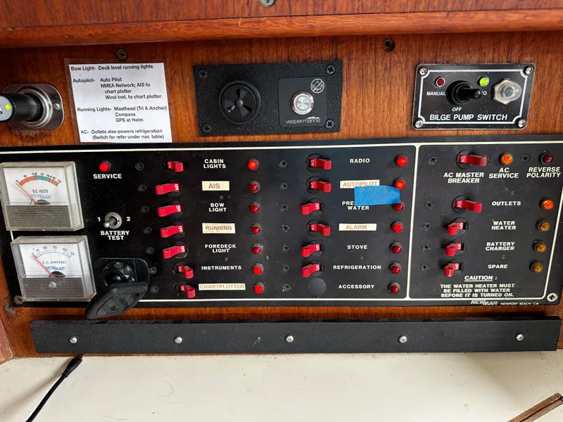 Slide: The Image of Control panel of a 1987 Ericson 34 2 sailboat with switches and gauges. - 17