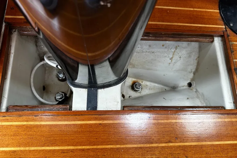 Slide: The Image of Close-up of Ericson 34 2 sailboat mast step, showcasing wooden deck details, 1987 model. - 26