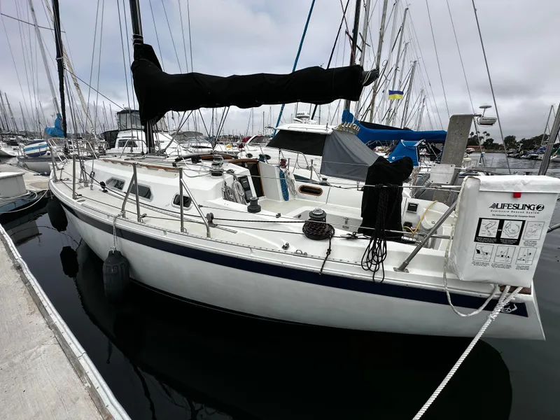 Slide: The Image of 1987 Ericson 34 2 sailboat docked at marina with Lifesling equipment. - 3