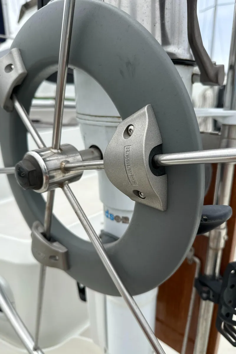 Slide: The Image of Close-up of a 1987 Ericson 34 2 sailboat steering wheel and rigging. - 30
